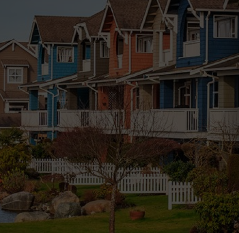 A row of colorful townhouses by the lake