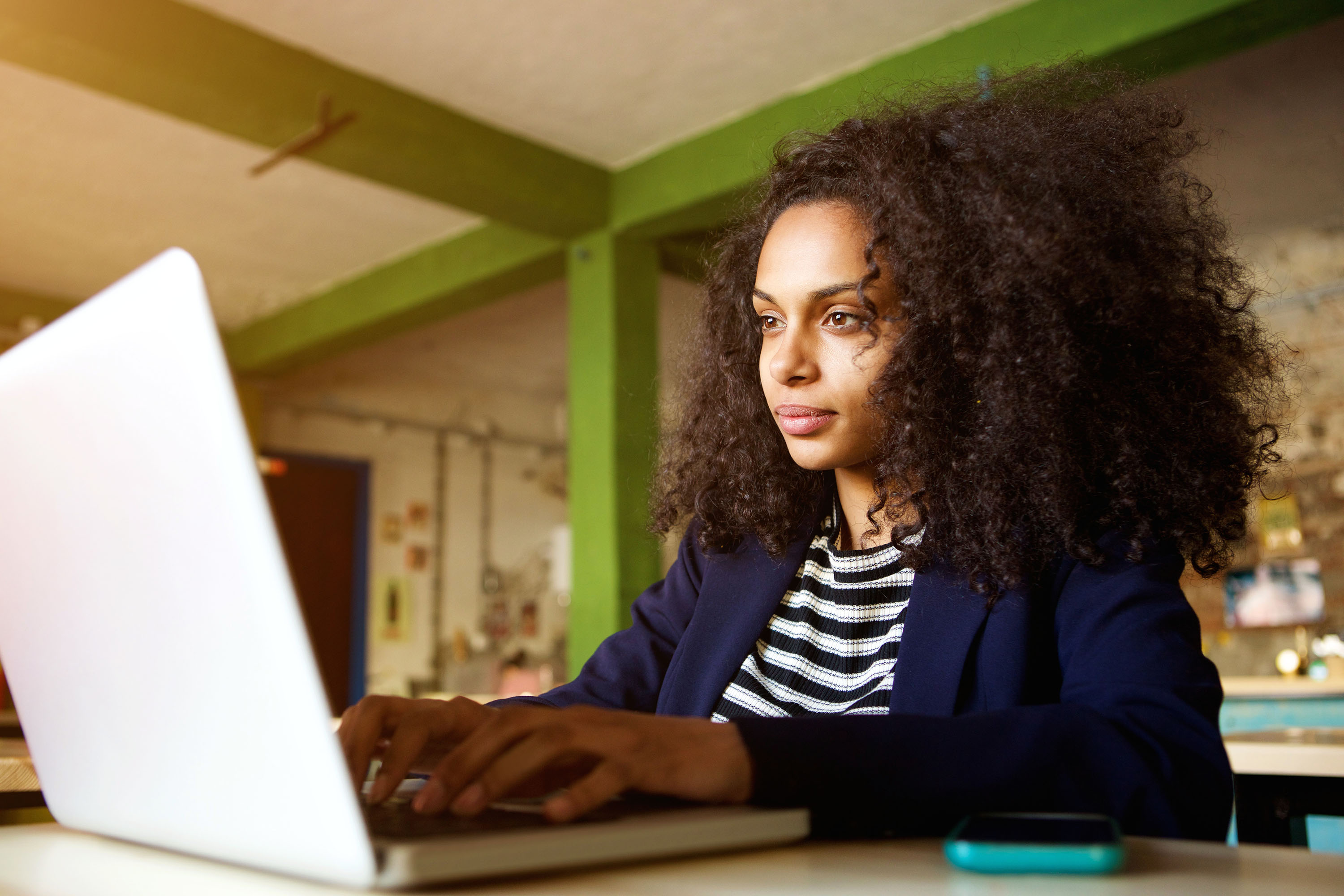 Woman typing on a laptop 