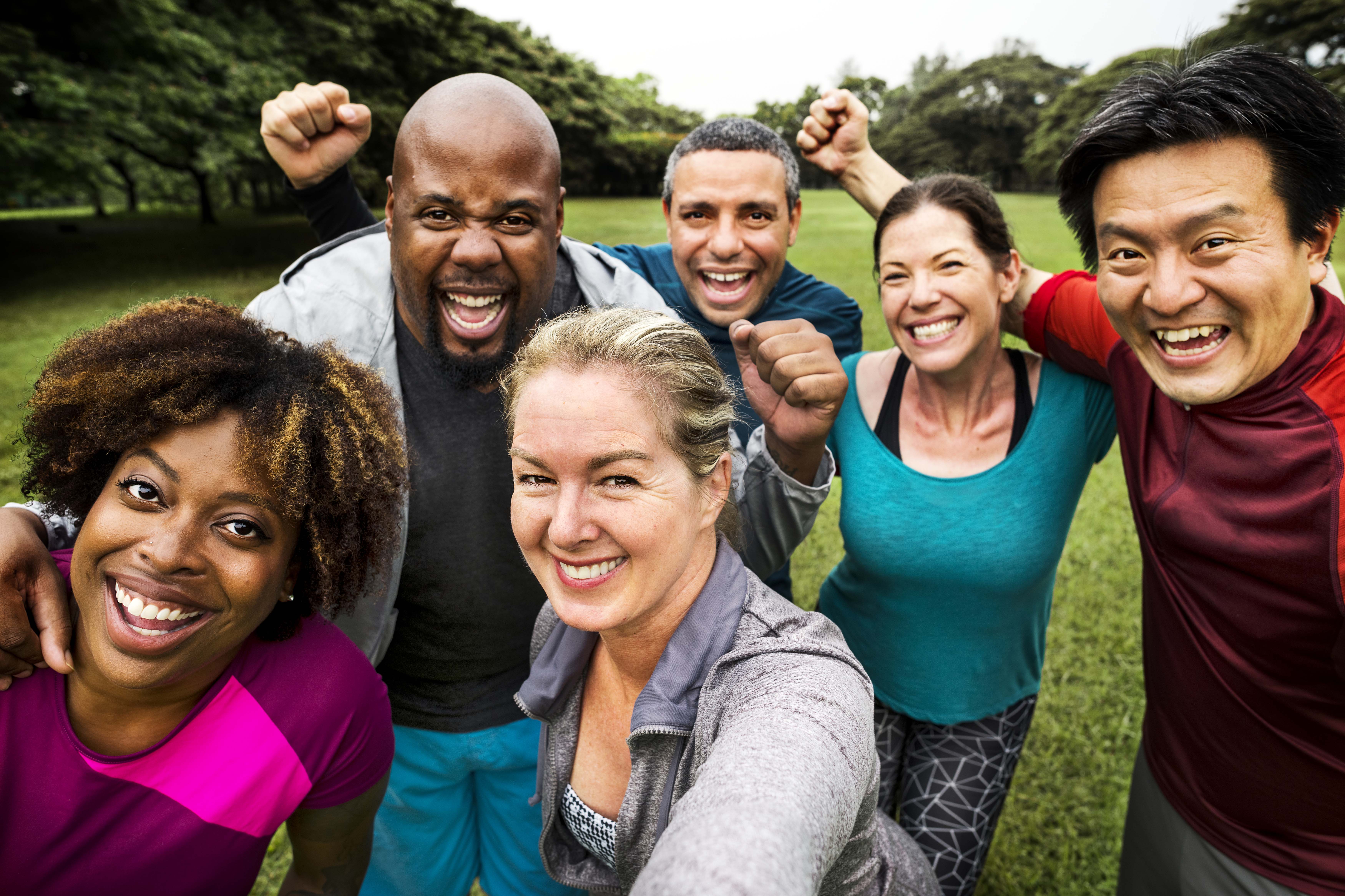 A group photo taken by a team of six individuals with a diverse range of racial backgrounds