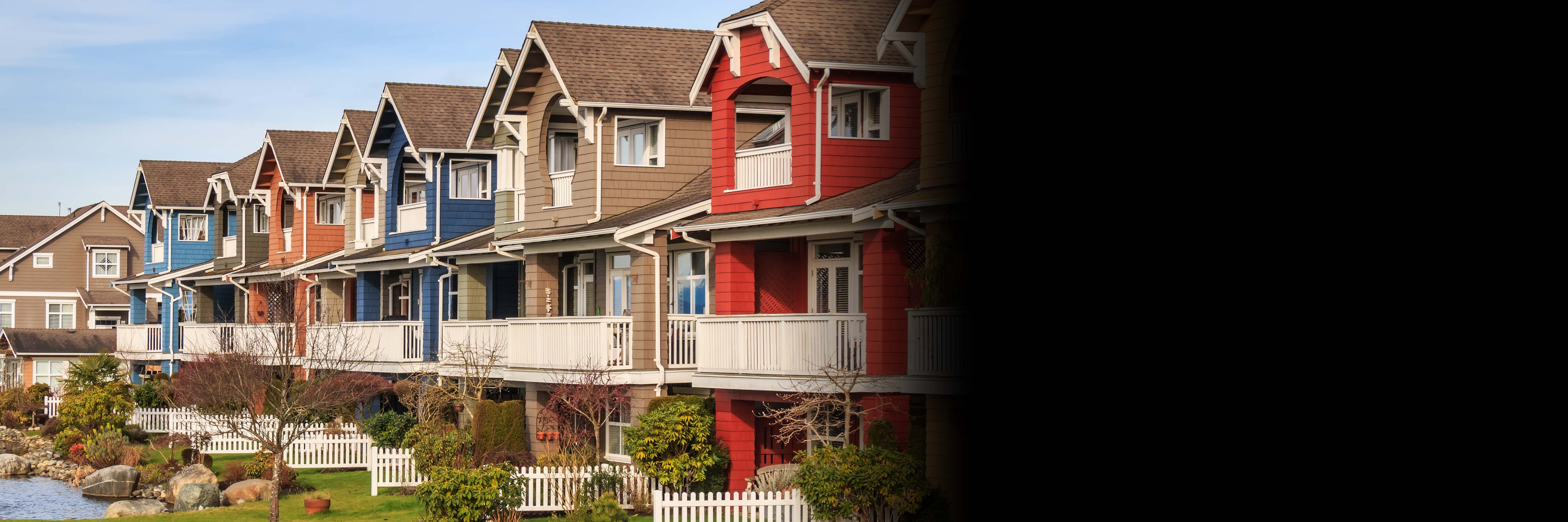 A row of colorful townhouses by the lake