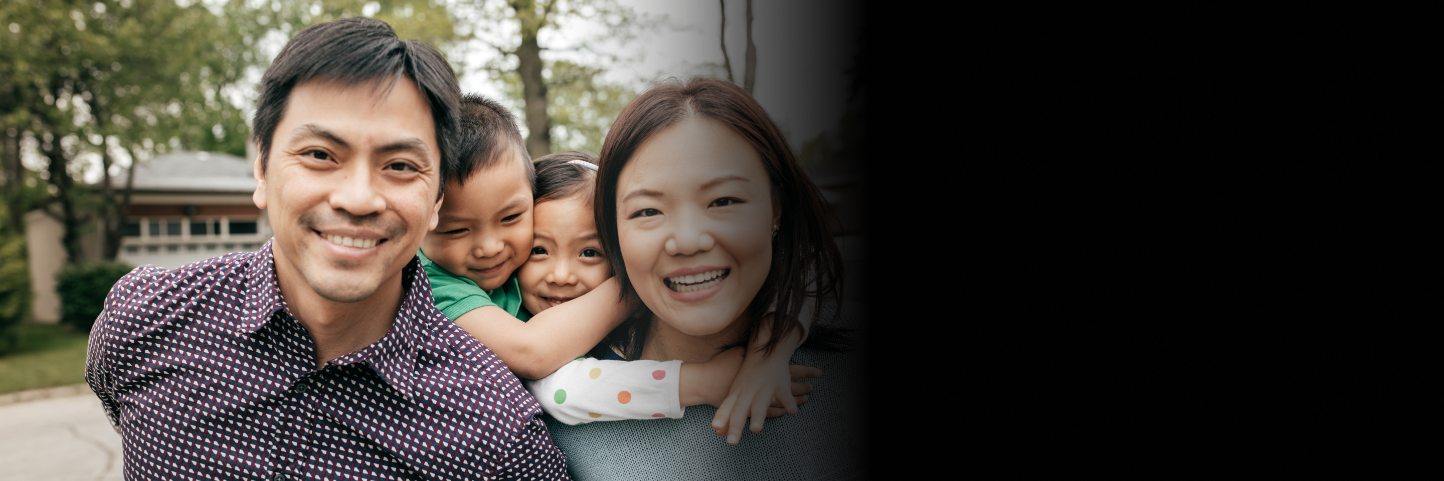 An asian family of four with the parents and two kids