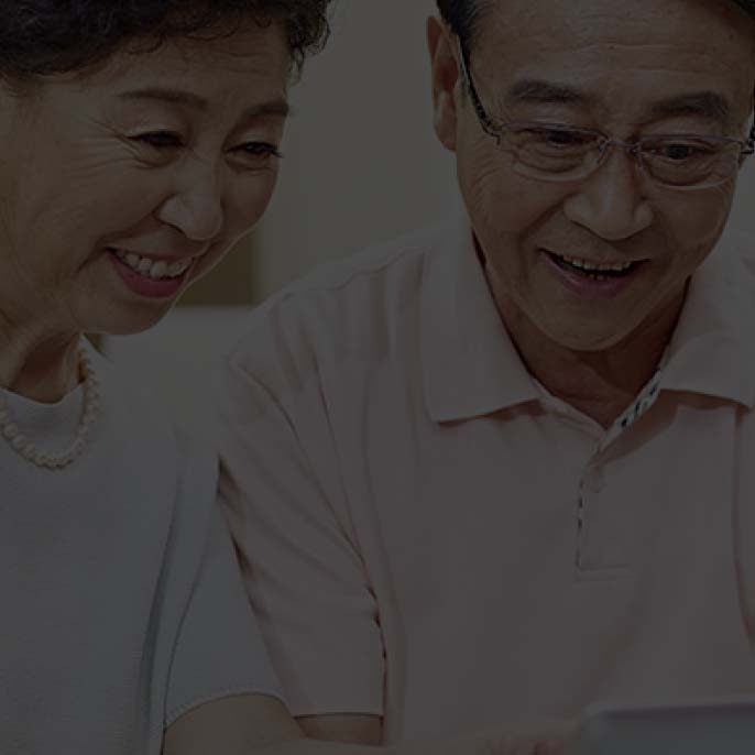 A senior couple using a table together