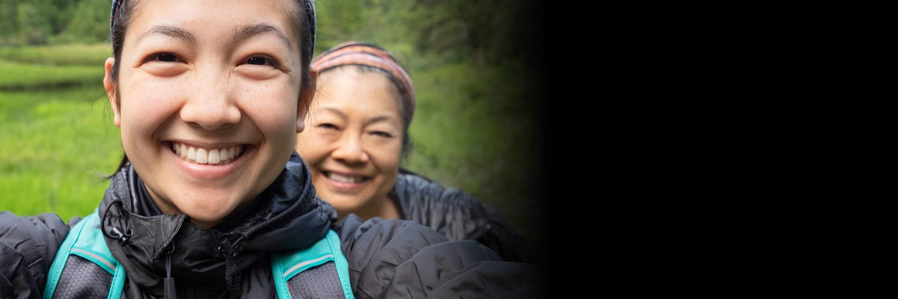 A lady smiling and holding the camera 