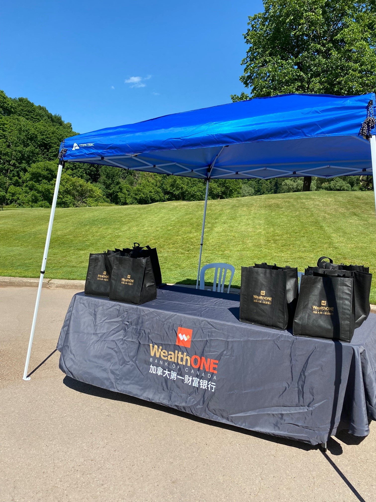 WealthONE tent and gift bags by the sponsored hole 
