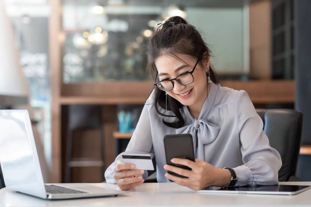 Girl smiling at phone 